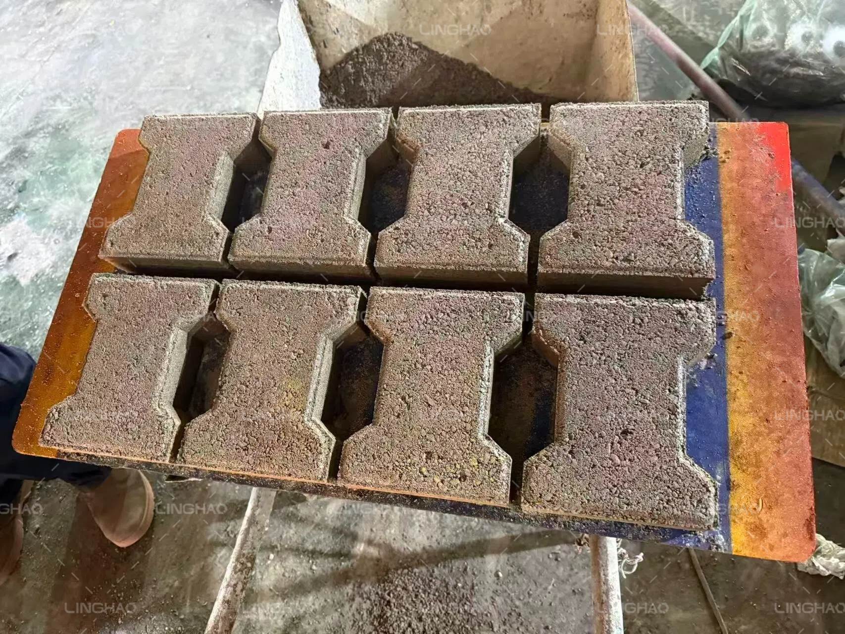 Finished QTJ4-40 machine ready for consolidation shipment at port—compact size ideal for small factories