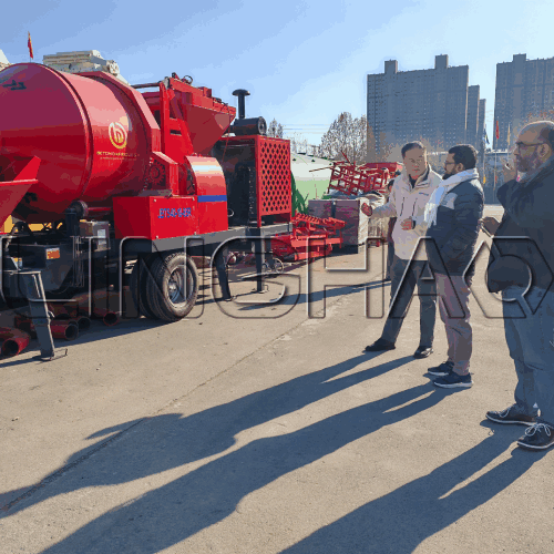 Bangladeshi customer inspecting self-loading concrete mixer truck at SanqGroup production line
