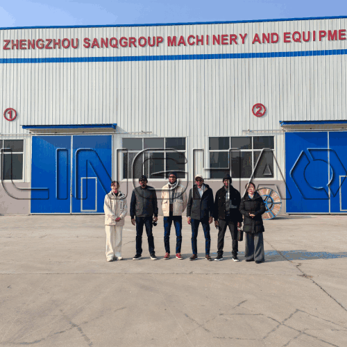 Cameroonian customer inspecting concrete mixer pump during final startup test at SanqGroup factory on December 28, 2025