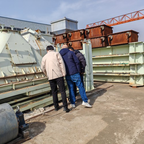 Client inspecting cement silo and mixer station production line during factory tour