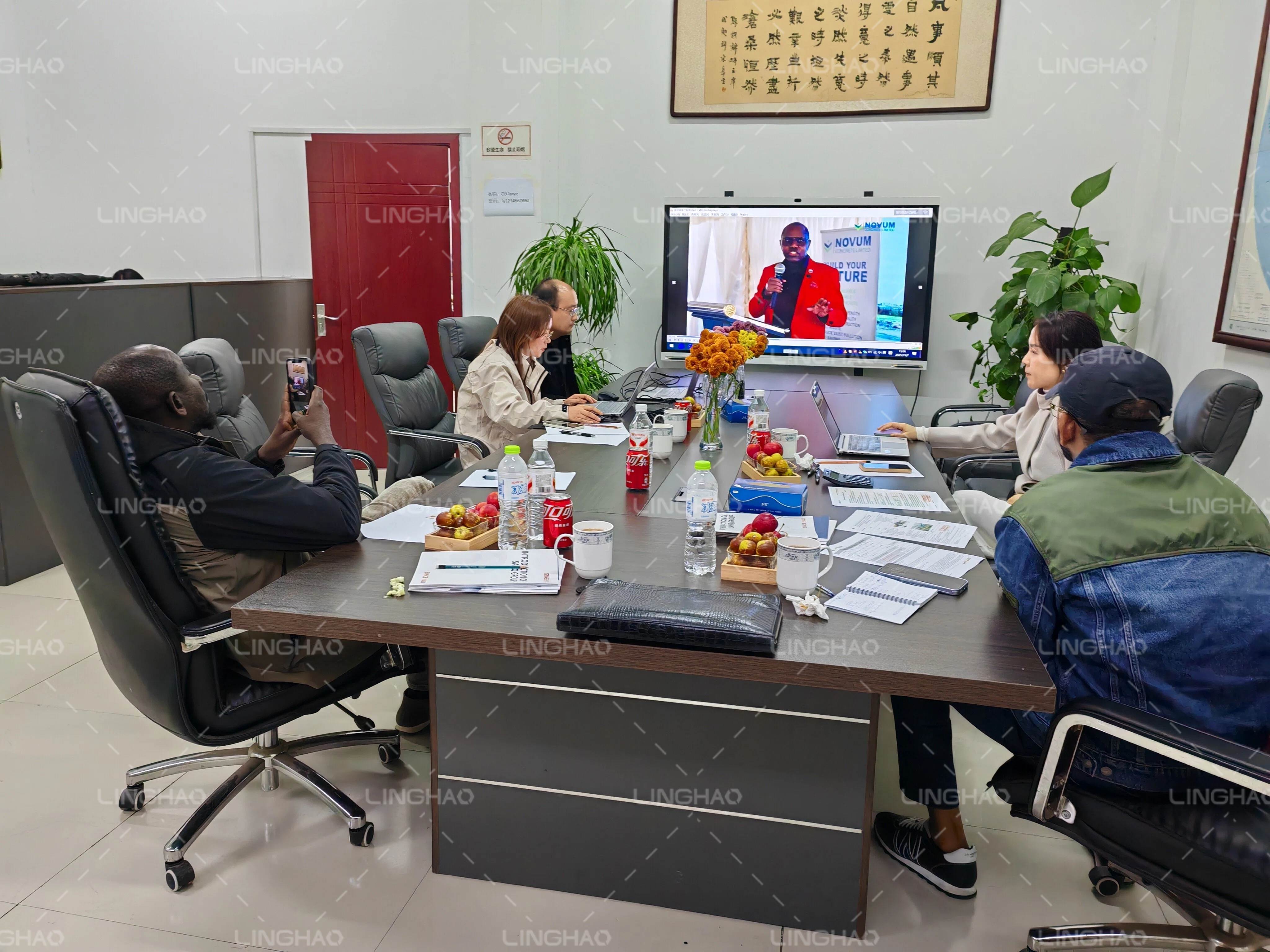 Friendly meeting in SanqGroup conference room with fresh fruit, discussing final payment and installation plans