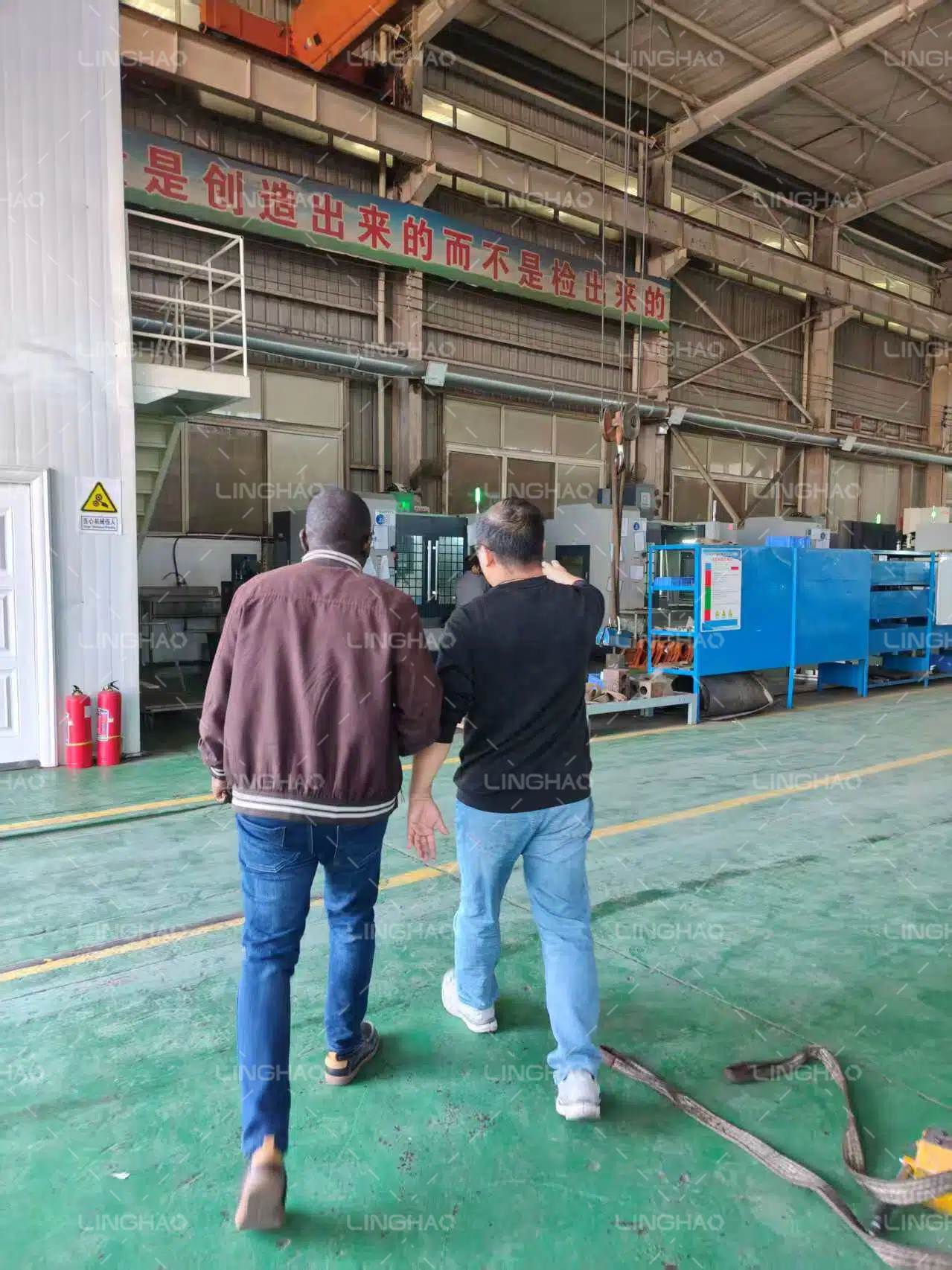 Ugandan customer delegation inspecting the JBT30 concrete mixing pump at Linghon Machinery factory