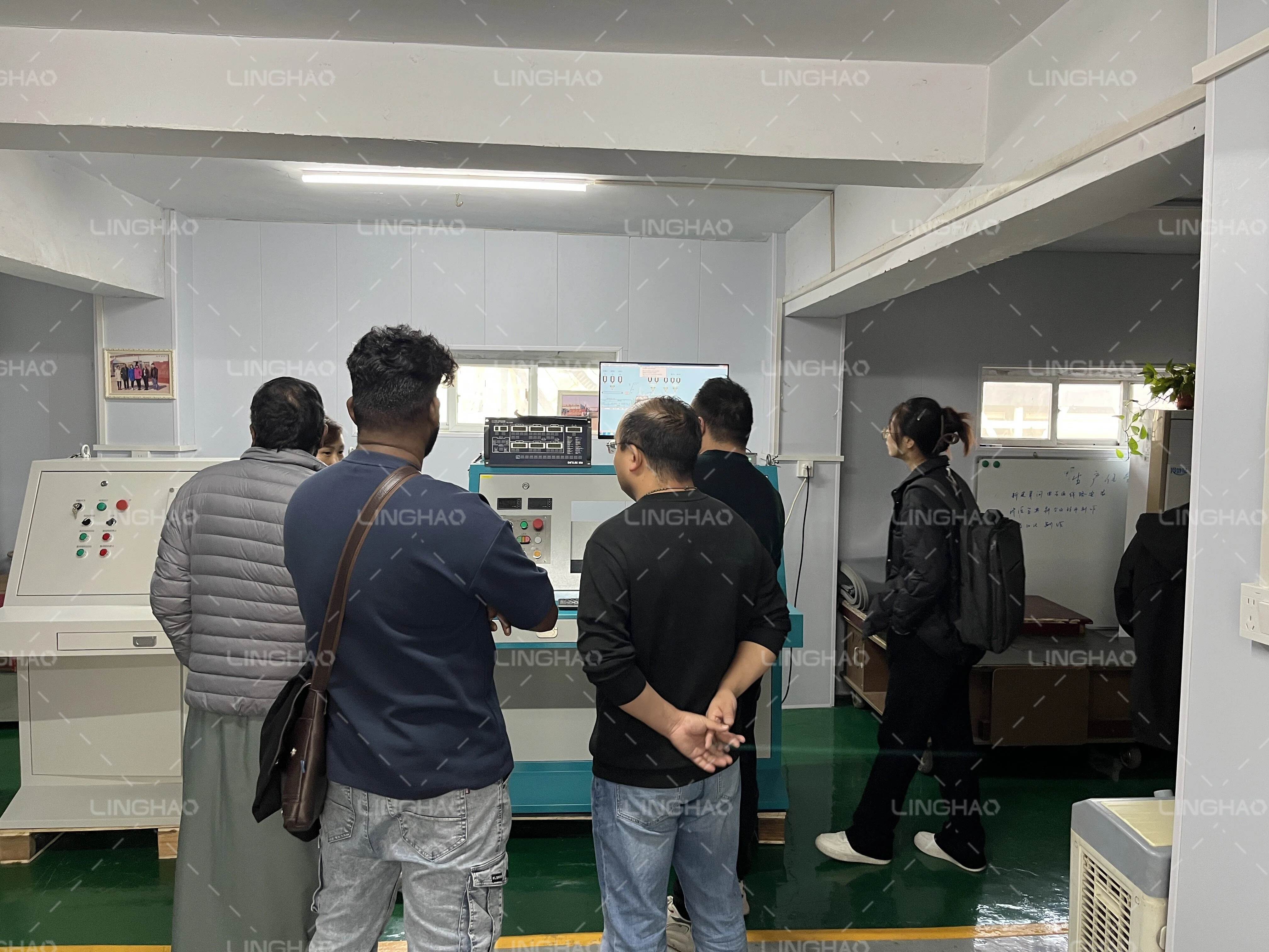 Saudi customer and Chinese agent discussing brick making machine specifications with SanqGroup team